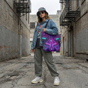 Woman in streetwear with denim jacket and psychedelic neon art tote bag in urban alley