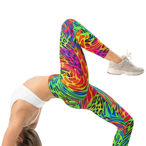 Person wearing vibrant psychedelic leggings with neon tiger print and white sneakers in yoga pose