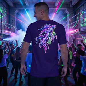 Smiling man at neon-lit party wearing purple t-shirt with colorful psychedelic squid art design