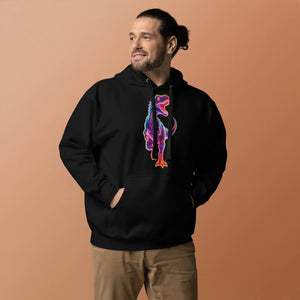 Man wearing black hoodie with colorful neon dinosaur graphic, beige pants, against tan background