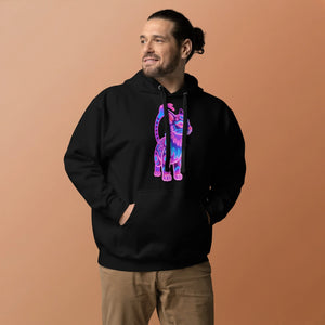 man wearing black unisex hoodie with neon pink and blue cat graphic on front against peach background