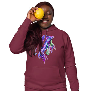 Smiling woman wearing maroon hoodie with neon psychedelic squid design holding lemon over eye
