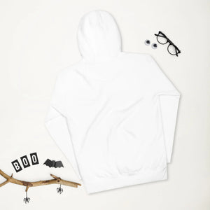 White unisex premium pullover hoodie laid flat with Halloween decorations including a twig, paper bats, spiders, 'BOO' letters, and glasses with googly eyes