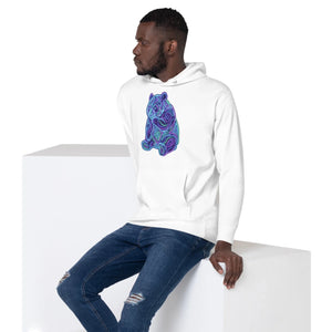 Man wearing white premium pullover hoodie with neon psychedelic bear design, paired with ripped blue jeans, sitting on white block