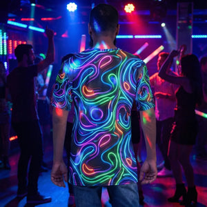Man wearing a vibrant psychedelic neon swirl t-shirt at a colorful club party with dancing crowd