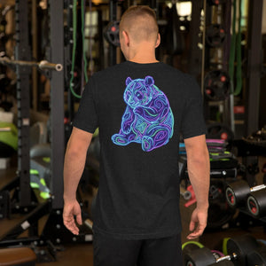 Man wearing black heather unisex t-shirt with neon psychedelic bear design on back in a gym setting