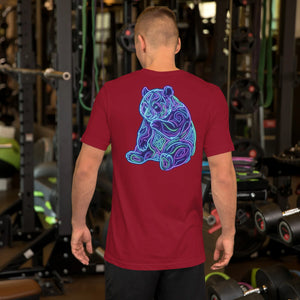 Man wearing cardinal red unisex t-shirt with neon psychedelic panda design standing in gym