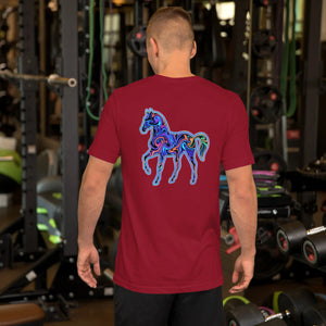 Man wearing a cardinal red unisex staple t-shirt with a vibrant psychedelic horse design on the back in a gym setting