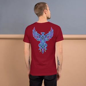 Man wearing cardinal red unisex t-shirt with vibrant neon blue and green phoenix design on back against beige and gray backdrop