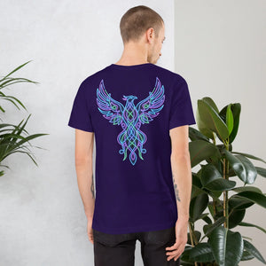 Man wearing unisex staple purple t-shirt with neon phoenix design on back, standing near green plants