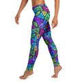 Woman wearing vibrant psychedelic leggings with colorful neon geometric pattern