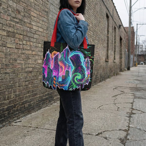 Woman wearing denim jacket carries Mad Lad Designs psychedelic neon art tote bag on city street