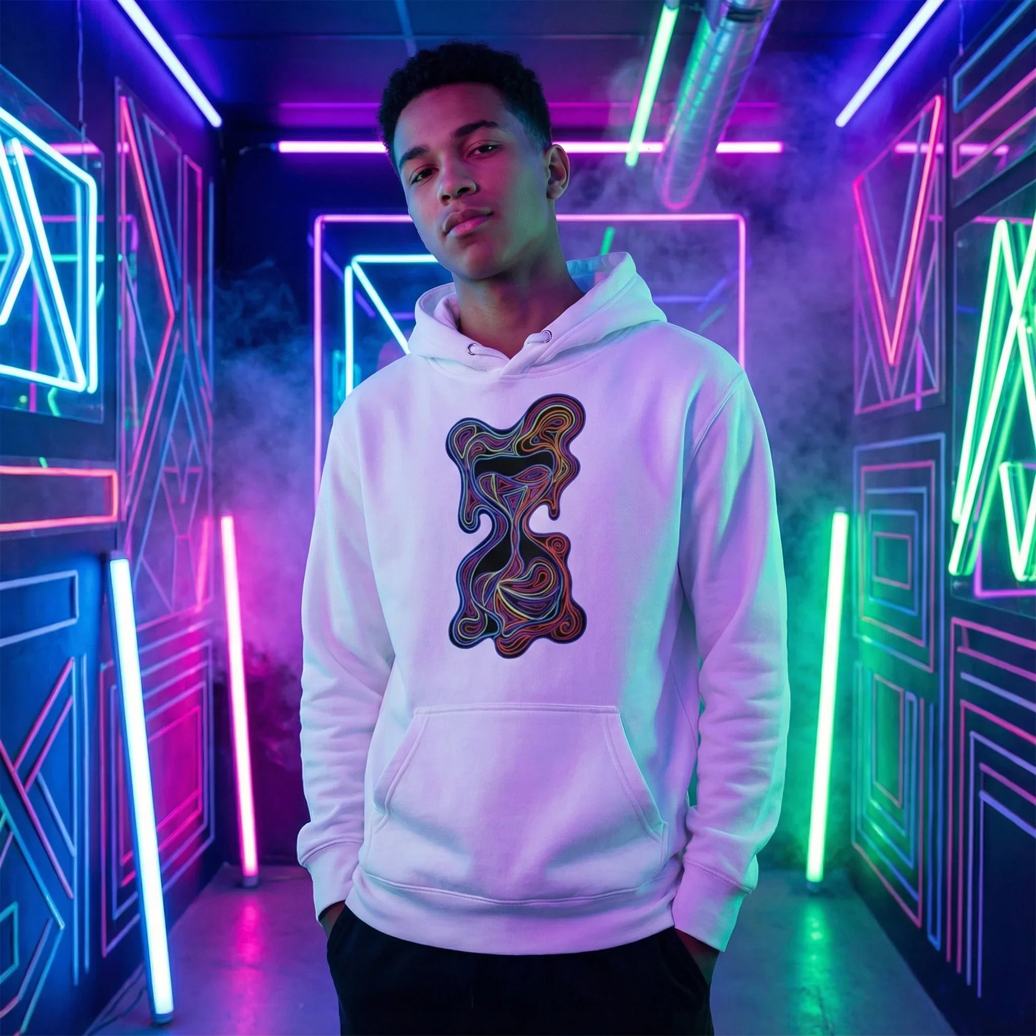 Young man wearing white hoodie with psychedelic abstract design in neon-lit room with colorful geometric lights and smoke
