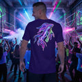 Smiling man at neon-lit party wearing purple t-shirt with colorful psychedelic squid art design