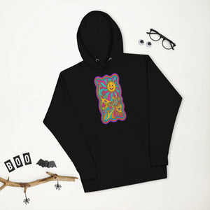 Black unisex pullover hoodie with vibrant psychedelic sun and mushroom art design on front, styled with glasses and Halloween decor