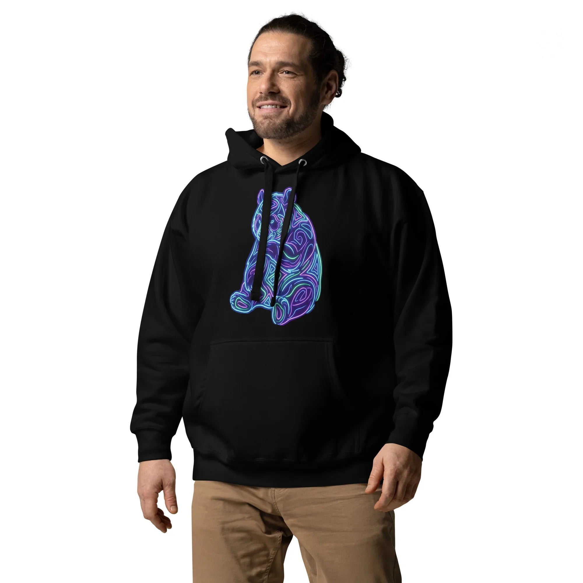 Man wearing black unisex premium pullover hoodie with neon psychedelic bear design, styled with khaki pants