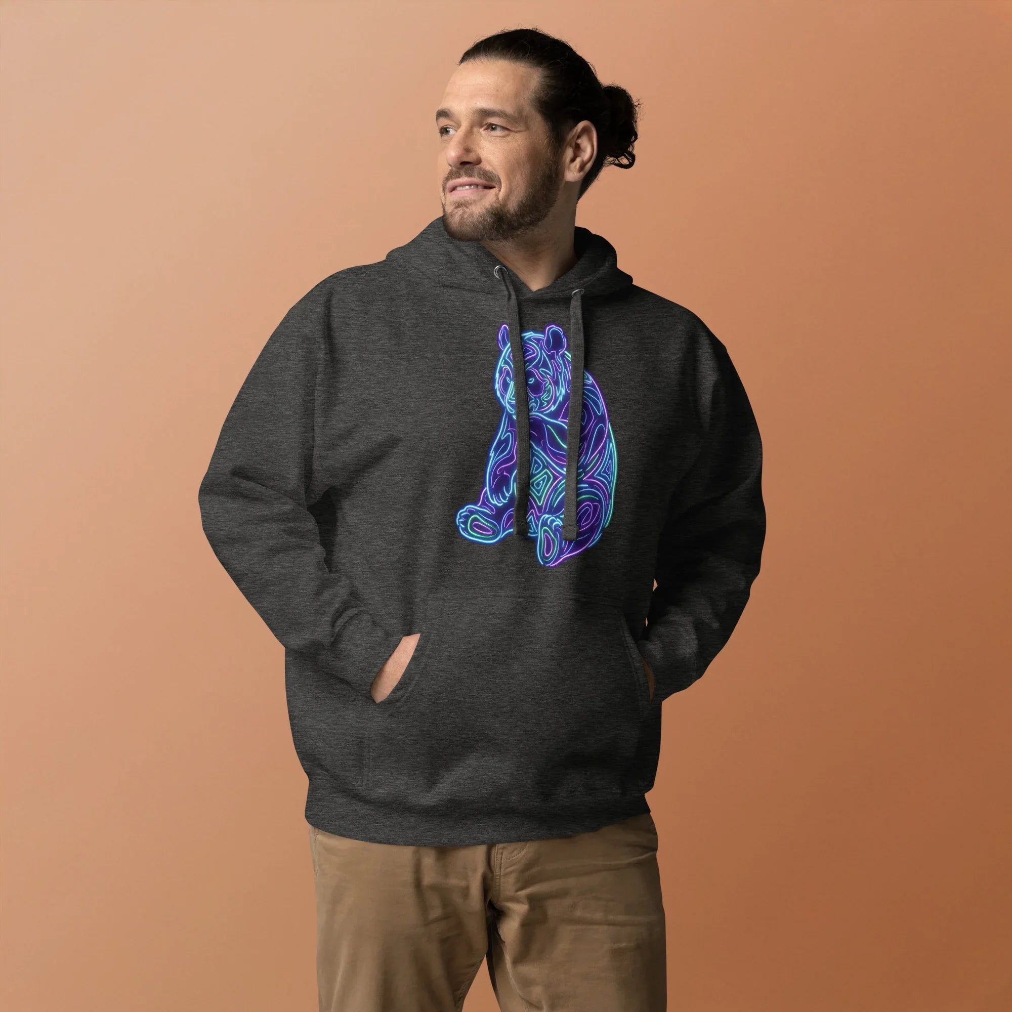 Man wearing charcoal heather hoodie with neon psychedelic bear design, casual streetwear style