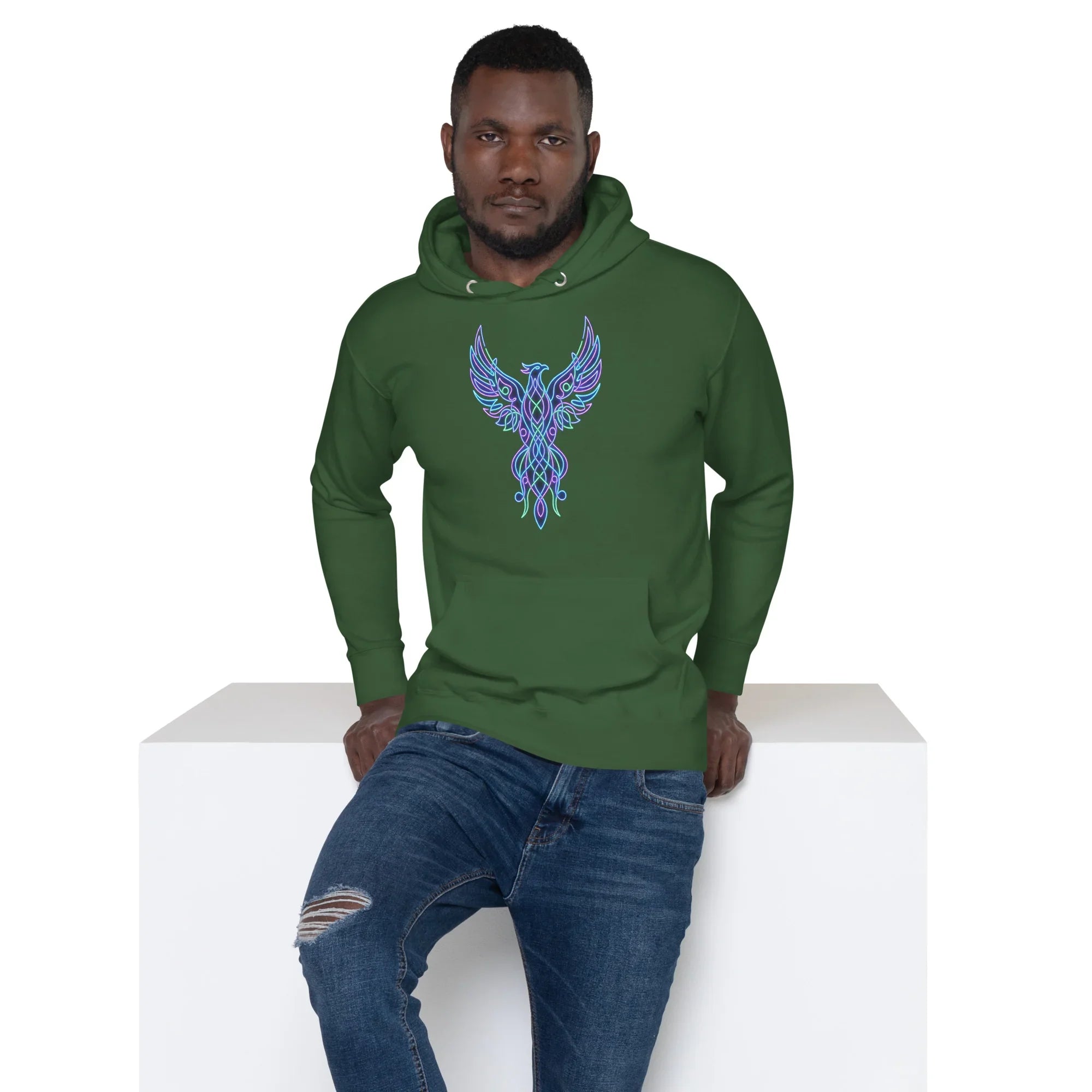 Man wearing forest green premium unisex pullover hoodie with vibrant neon phoenix graphic, paired with ripped blue jeans