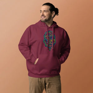 Man wearing maroon unisex premium pullover hoodie with colorful psychedelic face design and front pocket