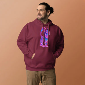 Man wearing maroon unisex hoodie with colorful neon cat graphic, beige pants, peach background