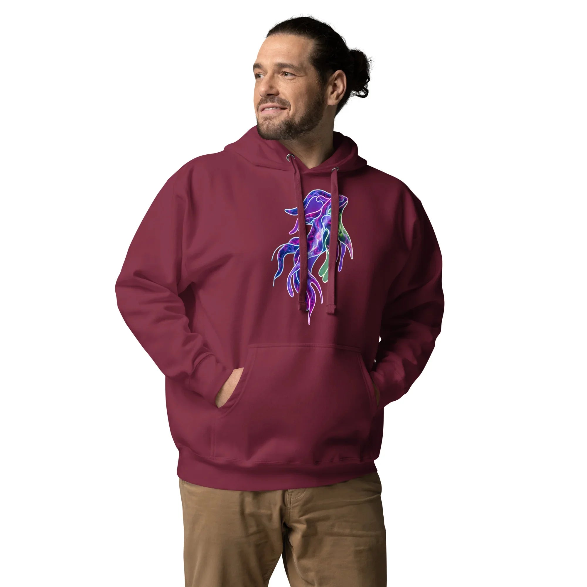 Man wearing maroon unisex premium pullover hoodie with vibrant neon abstract squid design, hands in pocket