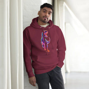 Man wearing maroon pullover hoodie with colorful T-Rex dinosaur graphic standing indoors by white brick wall