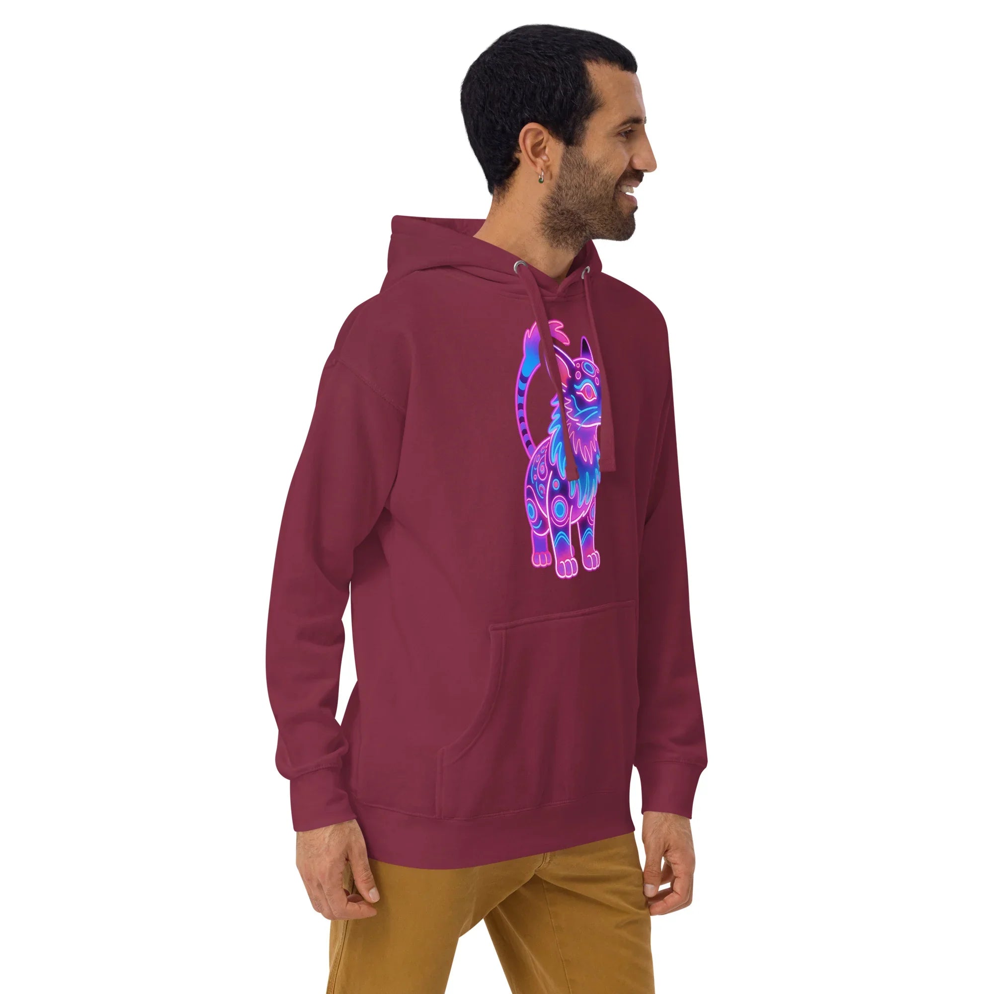 Man wearing maroon unisex pullover hoodie with neon blue and purple cat graphic, beige pants