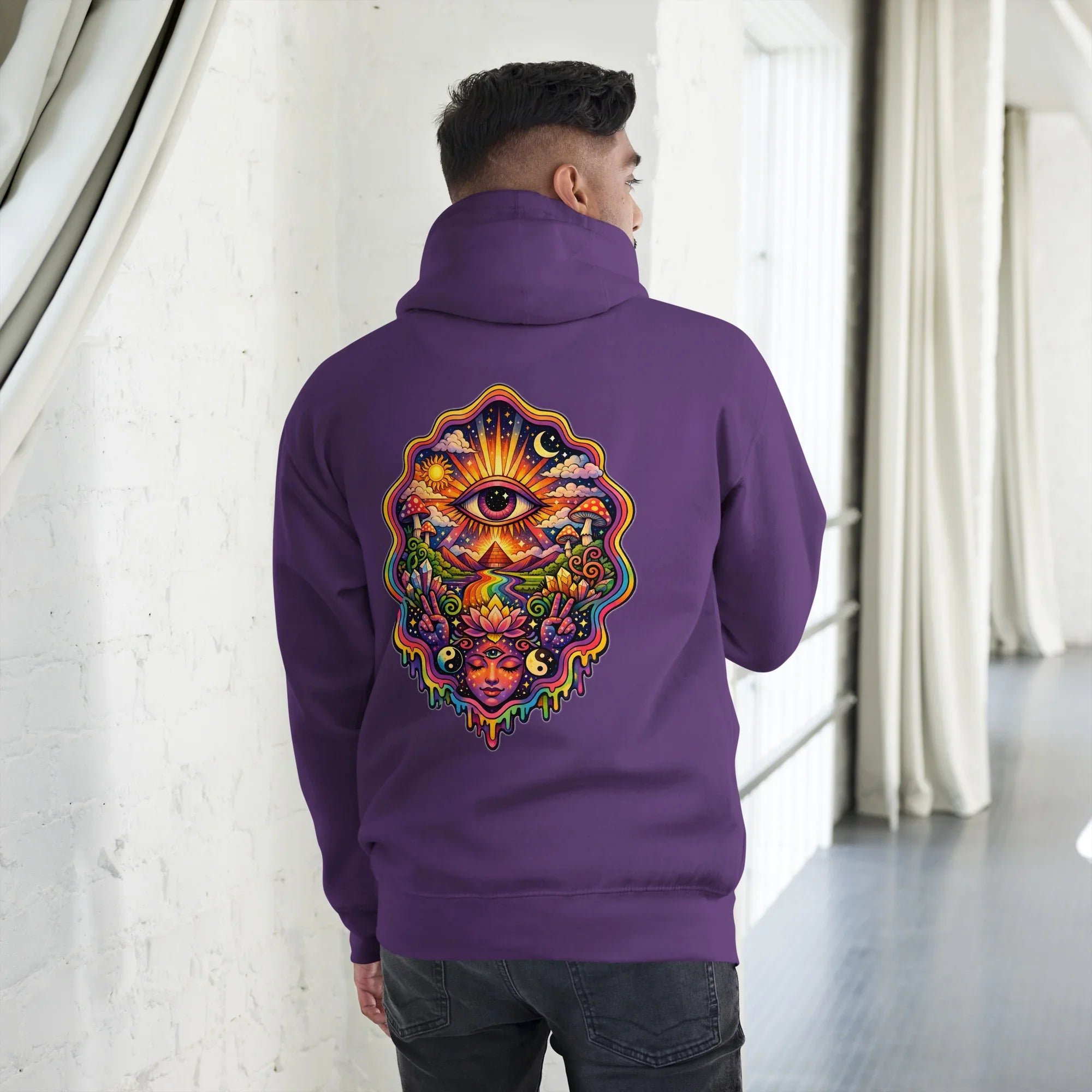 Man wearing purple unisex premium pullover hoodie with vibrant psychedelic eye and nature art on back