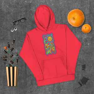 Red unisex premium pullover hoodie with colorful psychedelic sun and mushroom graphic, surrounded by Halloween candy, pumpkins, glasses, and bats