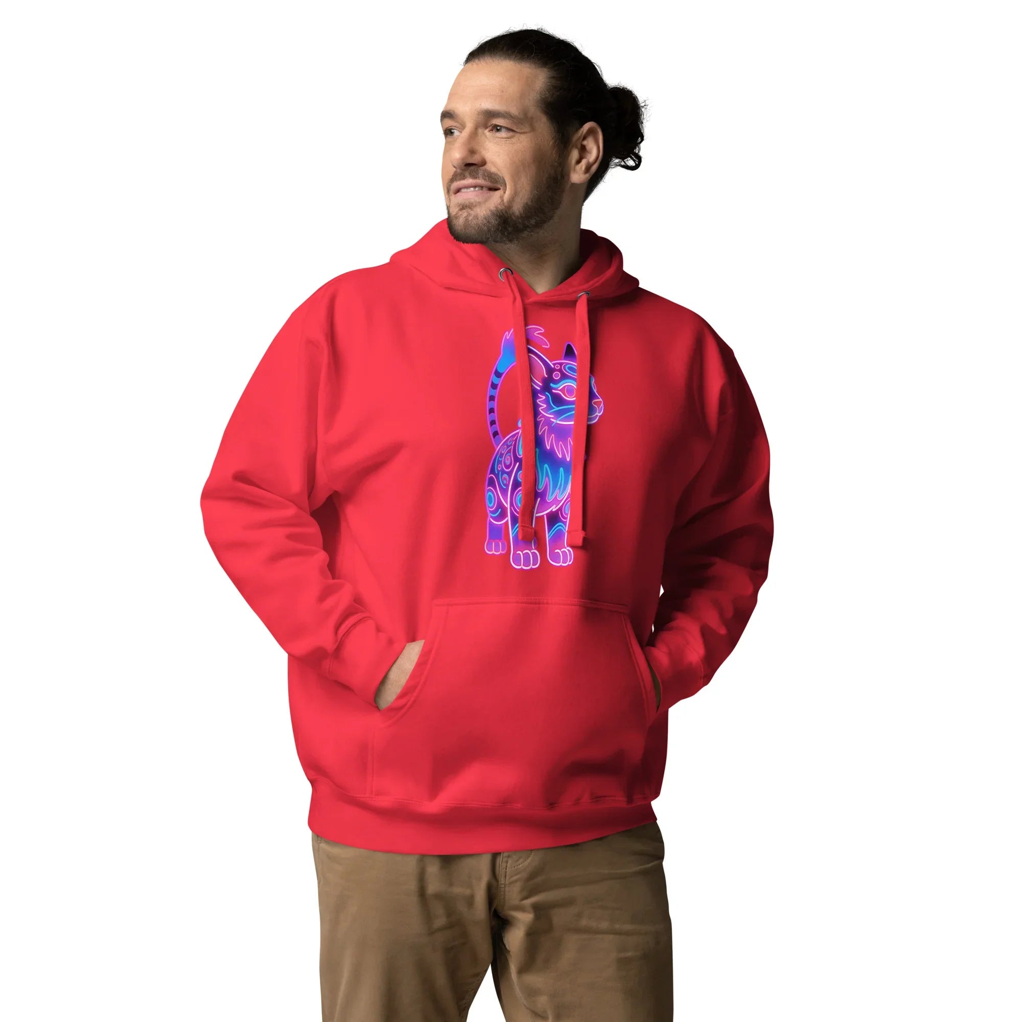 Man wearing red pullover hoodie with neon blue and purple cat graphic, hands in pockets