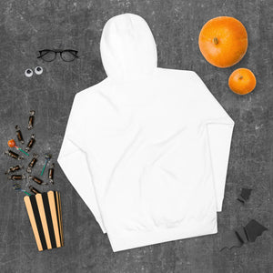 White unisex premium pullover hoodie flat lay with Halloween pumpkins, candy, glasses, and bat decorations on dark textured surface