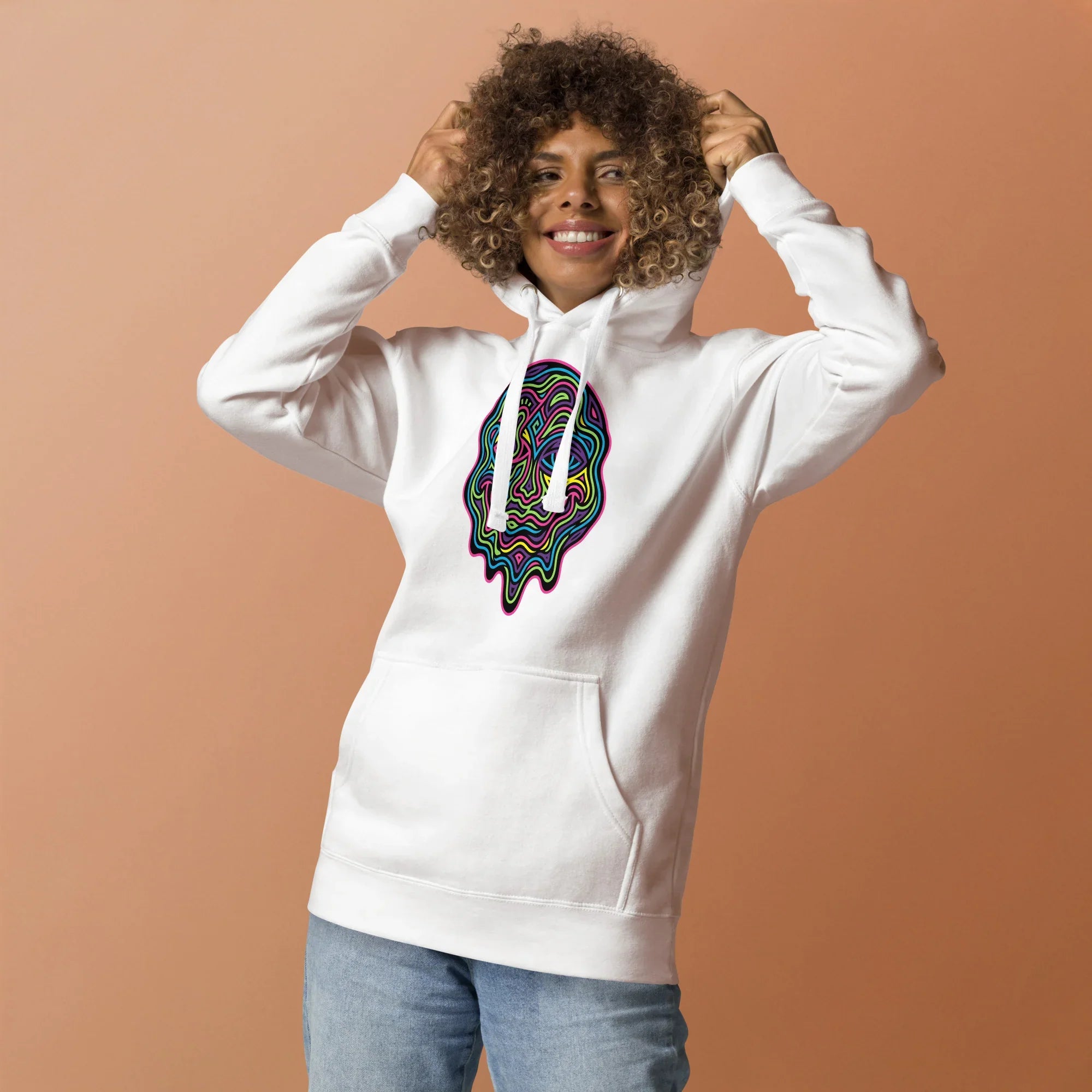 Woman wearing white unisex premium pullover hoodie with colorful psychedelic melting face design, casual streetwear
