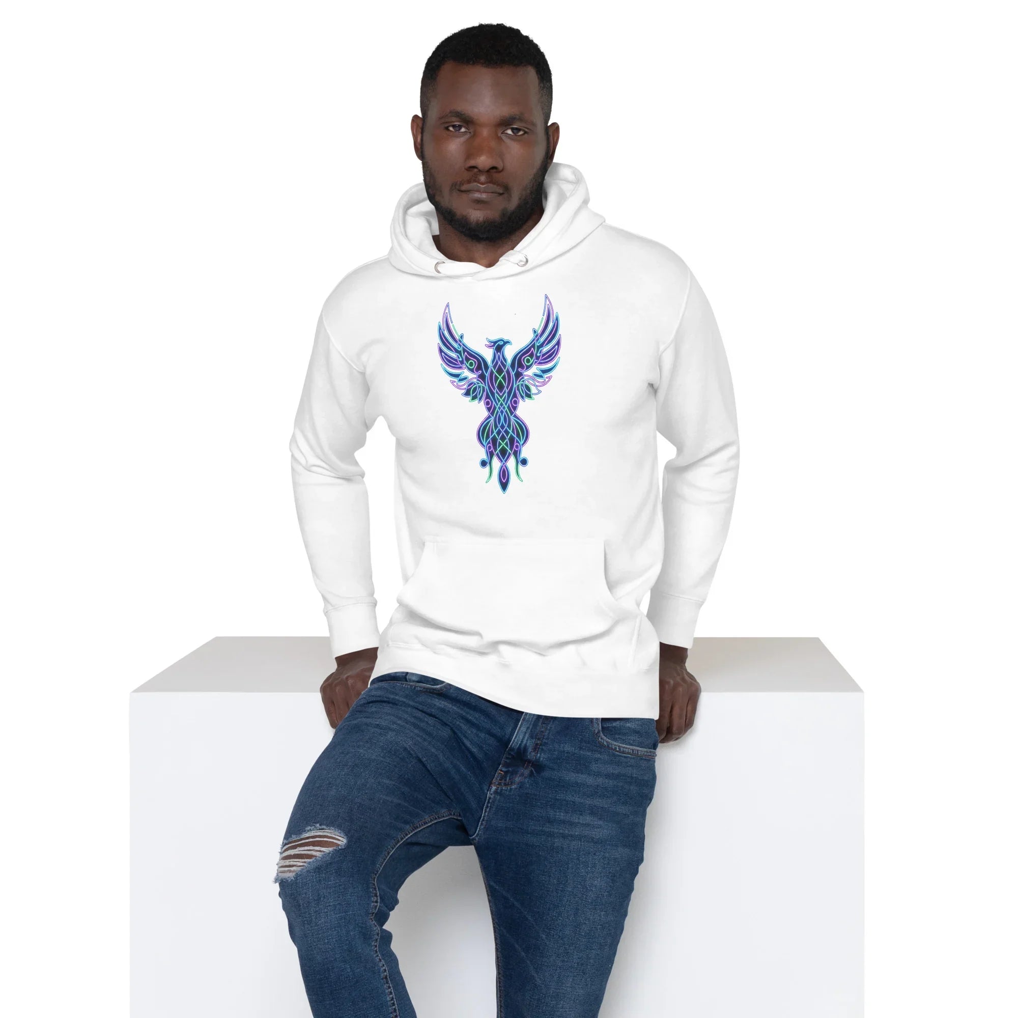 Man wearing white pullover hoodie with neon blue and purple phoenix design, paired with ripped blue jeans
