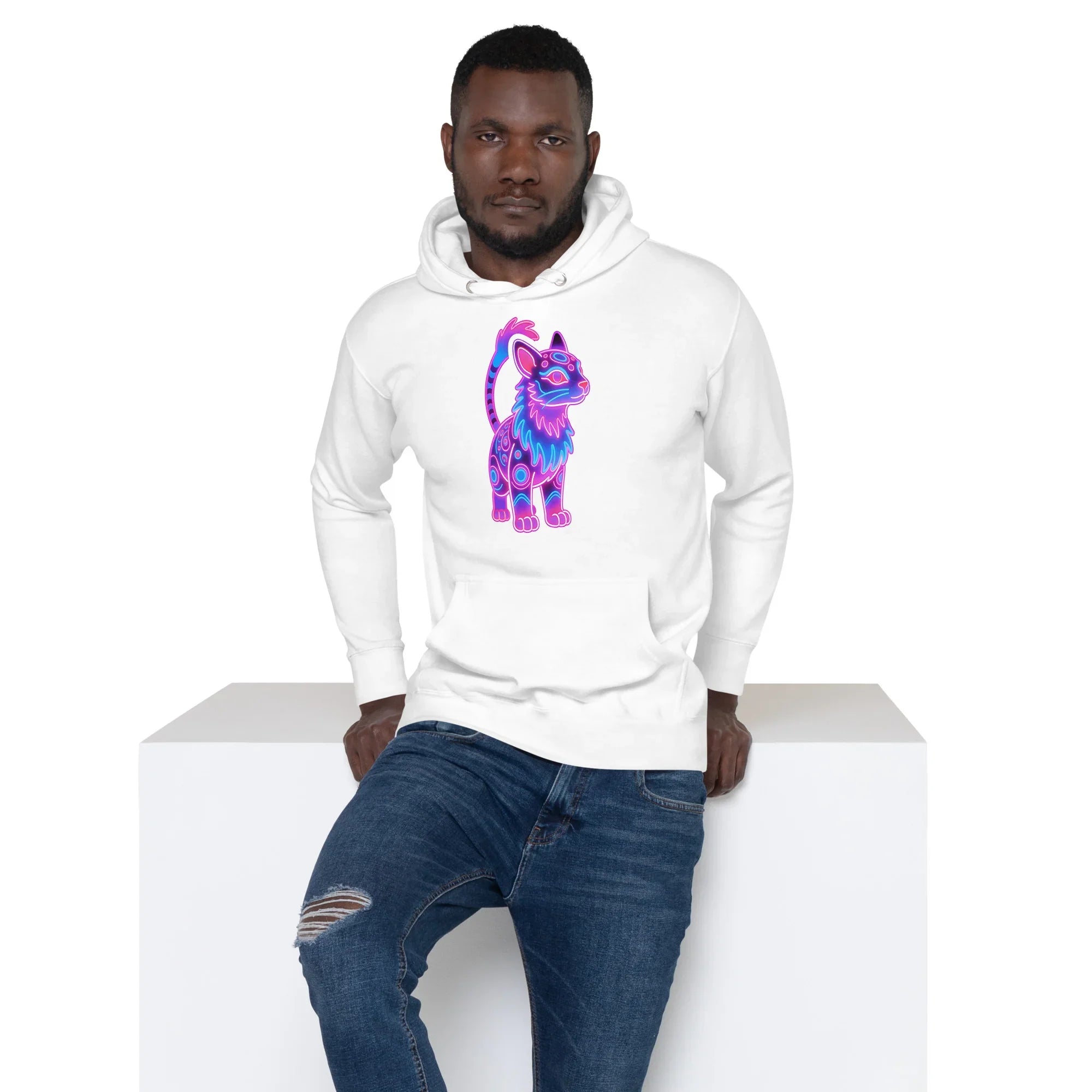 Man wearing white hoodie with colorful neon cat graphic, paired with ripped blue jeans
