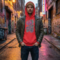 Man wearing red psychedelic hoodie with brain art and black leather jacket in graffiti alley at dusk