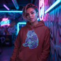 Person wearing red hoodie with neon psychedelic bear design in vibrant graffiti room with blue and pink neon lights