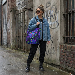Woman in denim jacket carrying psychedelic neon patterned tote bag, streetwear style