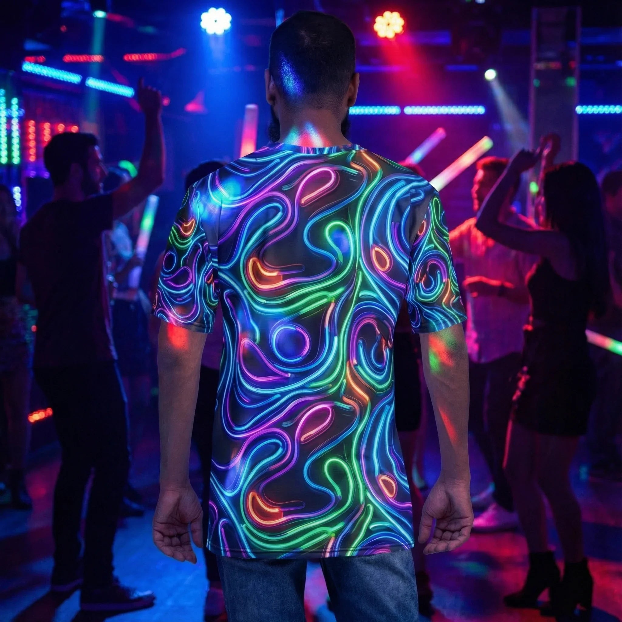 Man wearing a vibrant psychedelic neon swirl t-shirt at a colorful club party with dancing crowd
