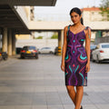Confident woman modeling a vibrant psychedelic print dress outdoors