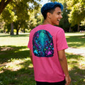 Smiling person outdoors wearing a pink psychedelic neon art t-shirt by Mad Lad Designs