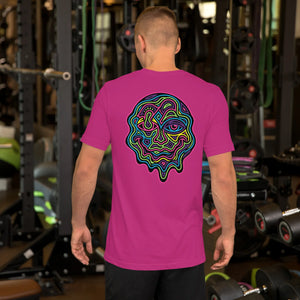 Man wearing berry-colored unisex T-shirt with neon psychedelic abstract face design in gym setting