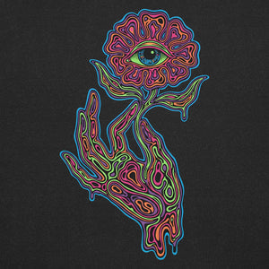 psychedelic neon colorful hand holding a flower with an eye in the center on black fabric