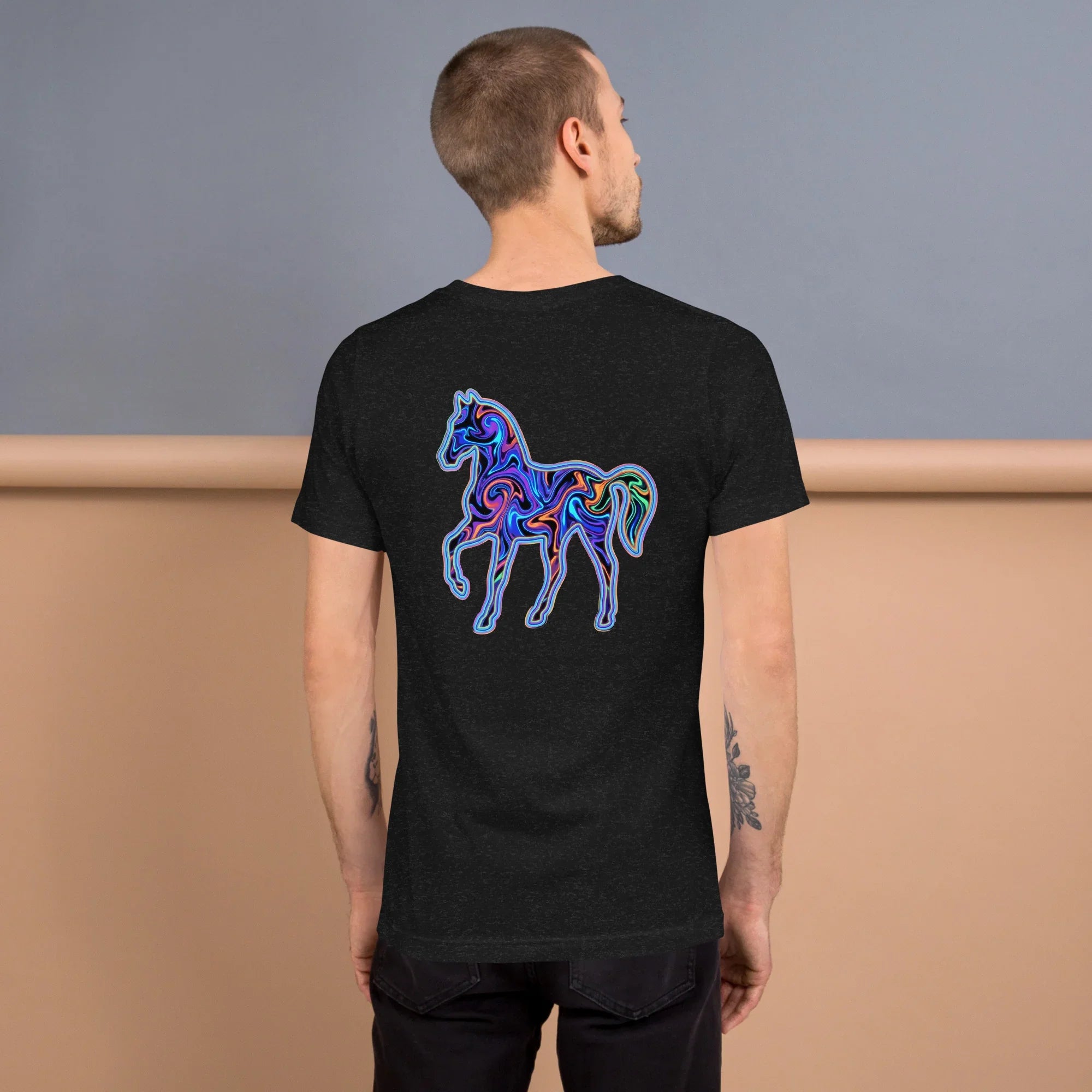 Man wearing black heather unisex T-shirt with colorful psychedelic neon horse design on back