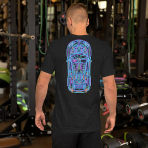 Man wearing black heather t-shirt with neon car blueprint design standing in gym with weights and equipment