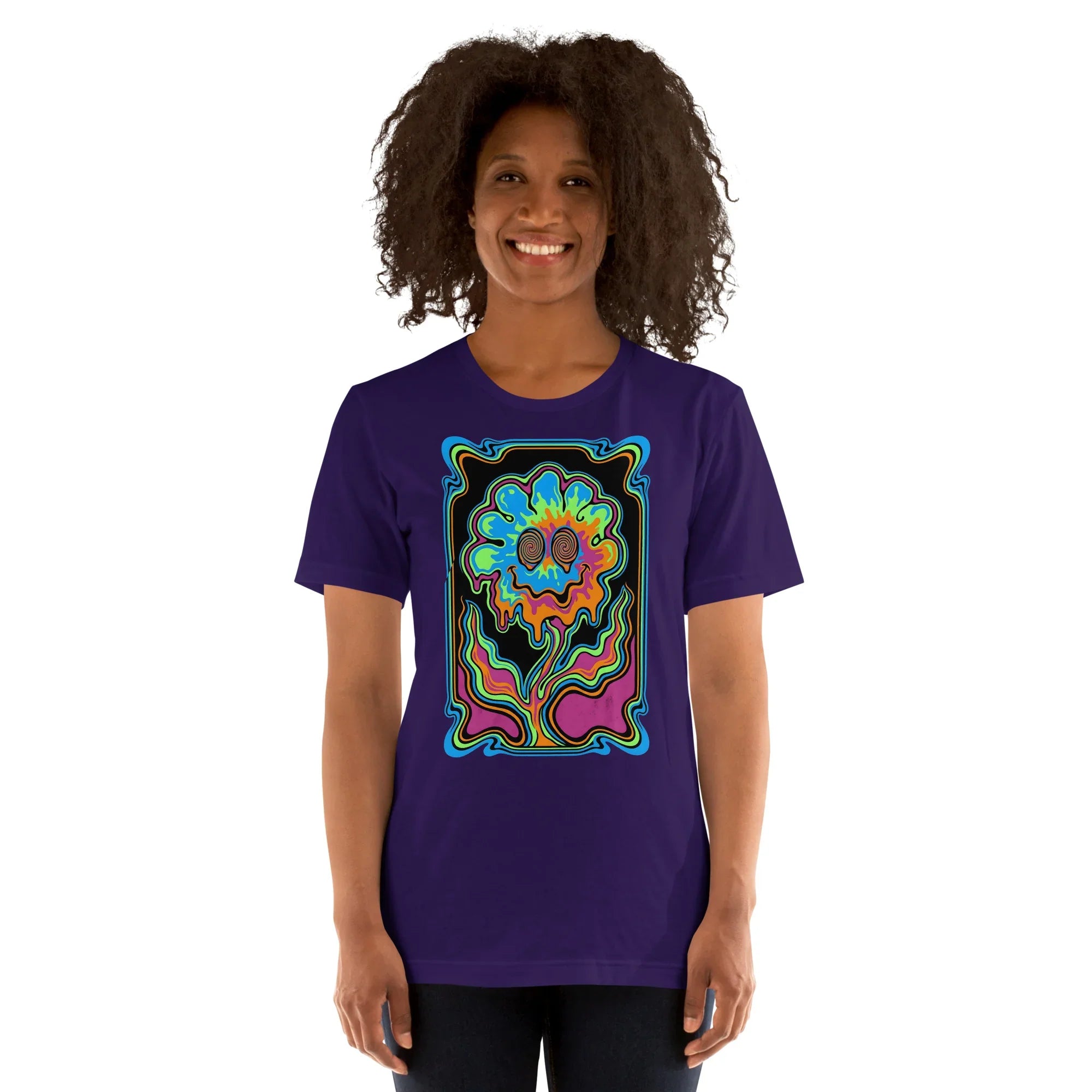 Smiling person wearing a purple unisex t-shirt featuring a psychedelic multicolor melting flower design